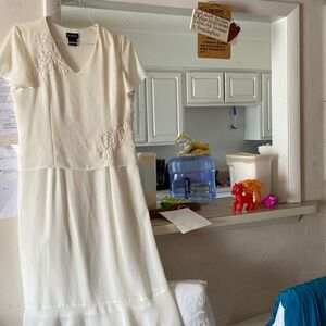 Delicate cream colored dress embroidered 100 percent polyesters